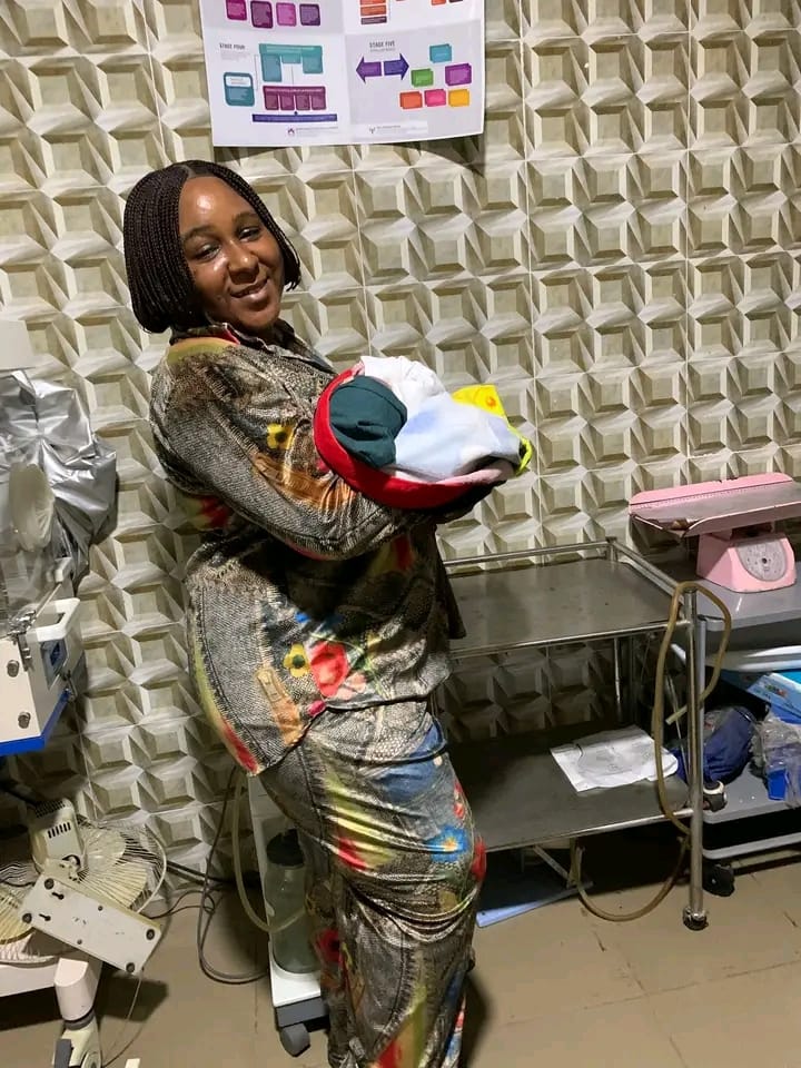 A happy mother holding her newborn baby